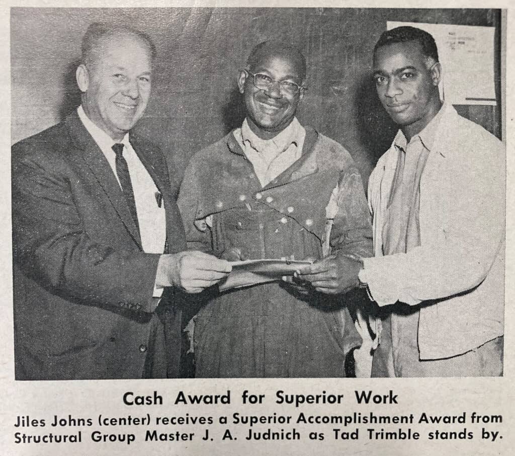 3 Hunters Point Shipyard Employees receiving and award and bonus check for safety and process improvements